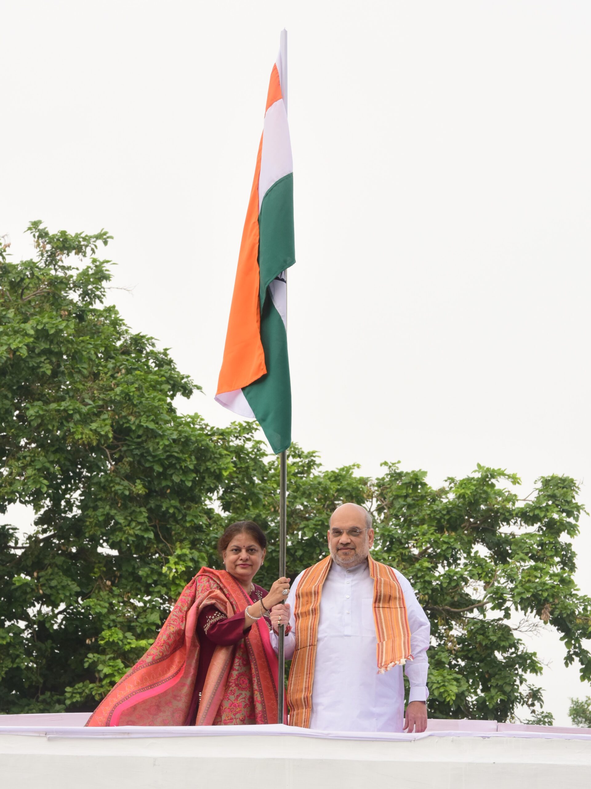 Home minister Amit Shah and wife Sonal Shah with Indian flag